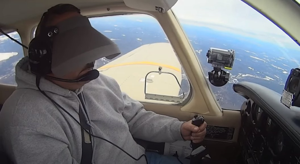 a student flying under the hood during an ipc check