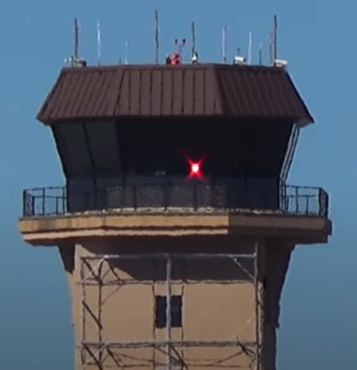 steady red light gun signal from an actual airport control tower